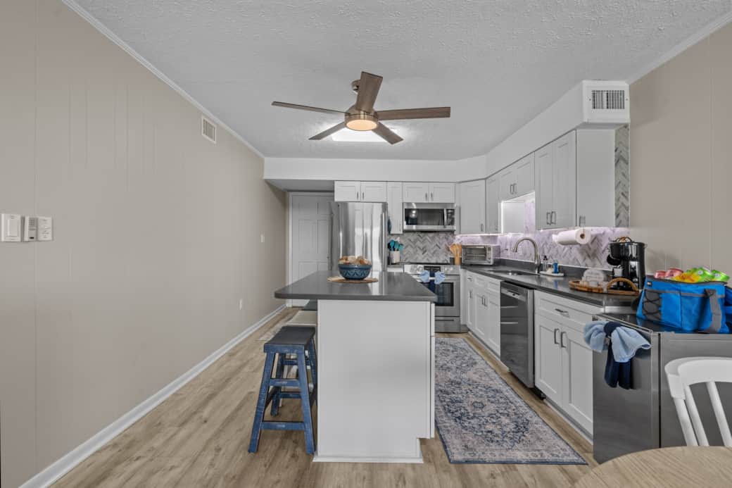 Bright and Modern Kitchen - This well-lit & fully-equipped kitchen offers a spacious center island.
