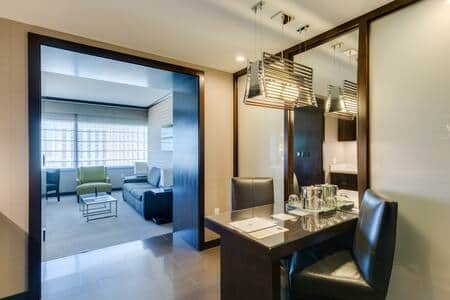 Welcoming entryway opening into the suite's spacious living area
