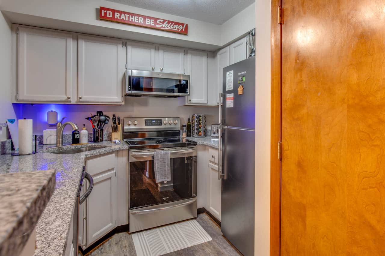 The kitchen features granite countertops and new appliances!