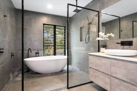 Modern bathroom upstairs with bathtub.
