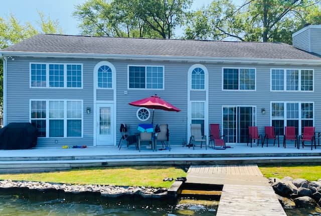 Back of the house. Amazing deck for friends and family to gather.  Private dock.