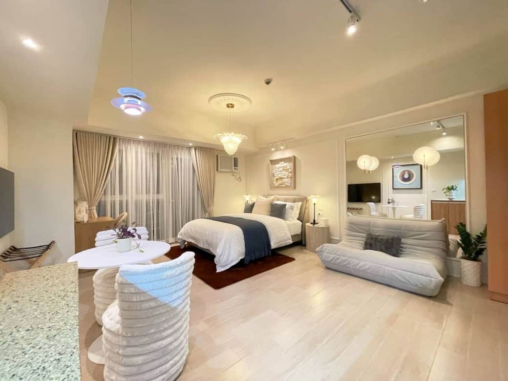 The cozy living room features a welcoming two-seater sofa that is so comfortable, you won't want to get up - perfect for relaxing and enjoying your day in the room.