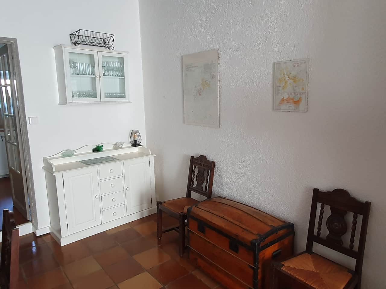Sideboard, glass display case and chest with board games