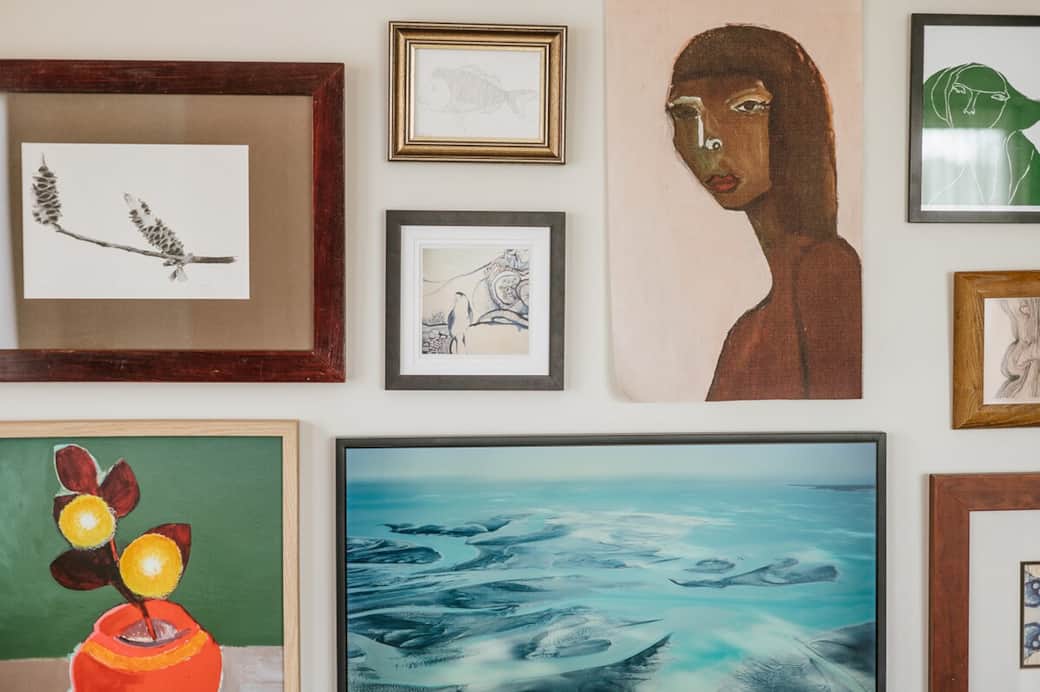 Curated art throughout the home, smart art tv in the middle of the art wall.