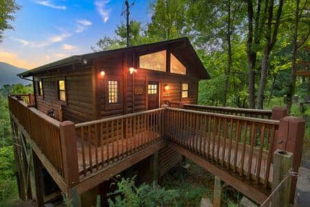 Wrap around main level deck and front door entry. Serene mountain views!