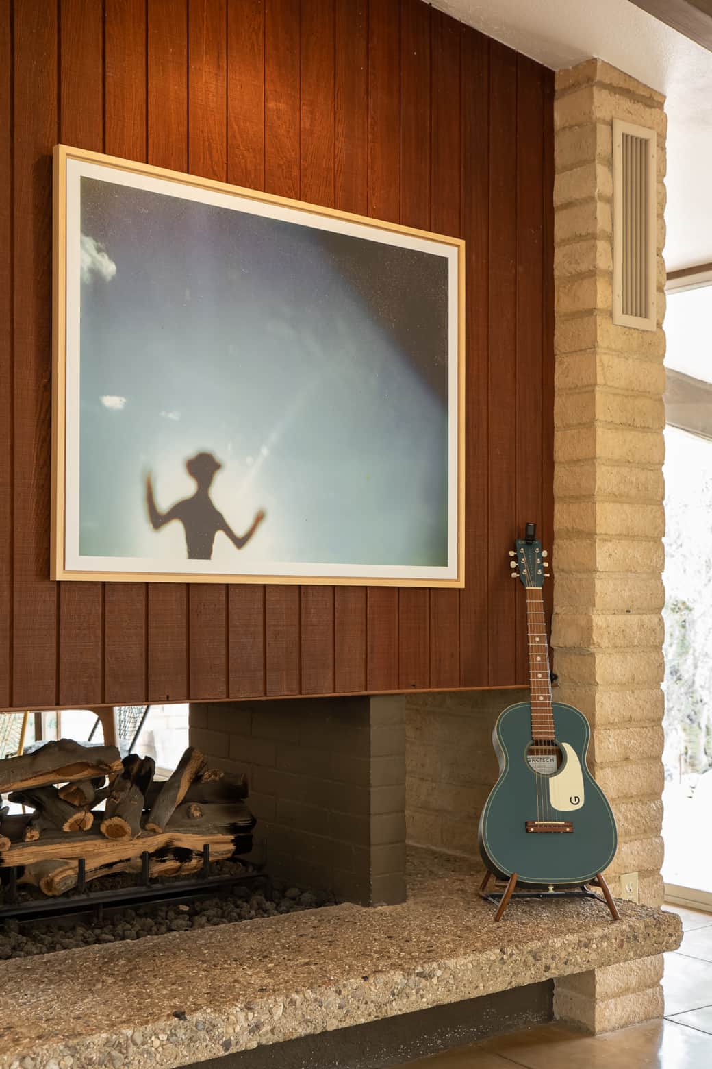 Fireplace and guitar.