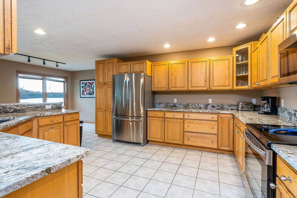 Fully equipped kitchen, one of three full-size fridges for feeding a crowd