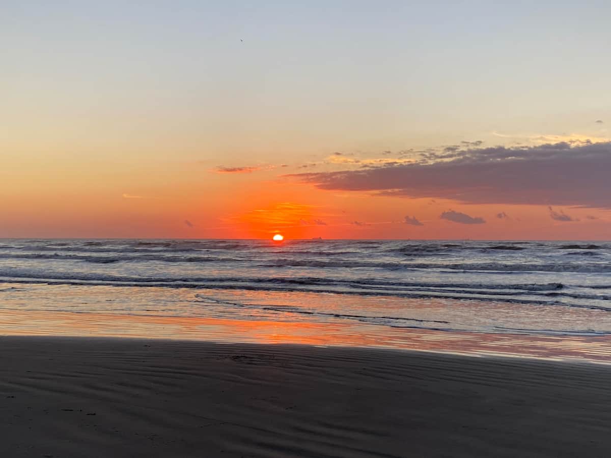 Sunset glow along the Galveston Seawall near White Magnolia