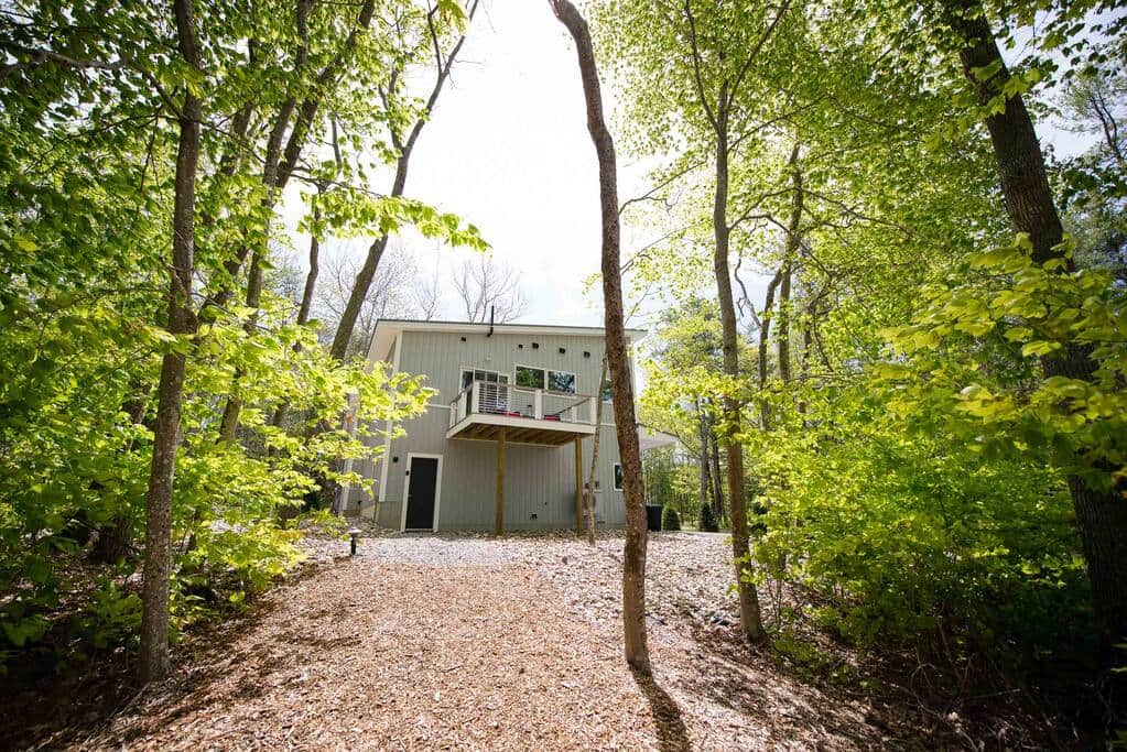 Path leading to the cottage's bathroom in a separate building from the tiny house Path leading to the cottage's bathroom in a separate building from the tiny house