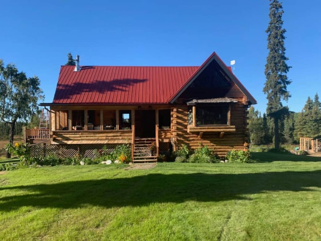 The cabin as seen from the circle driveway. The lake is directly behind the cabin. The cabin as seen from the circle driveway. The lake is directly behind the cabin.
