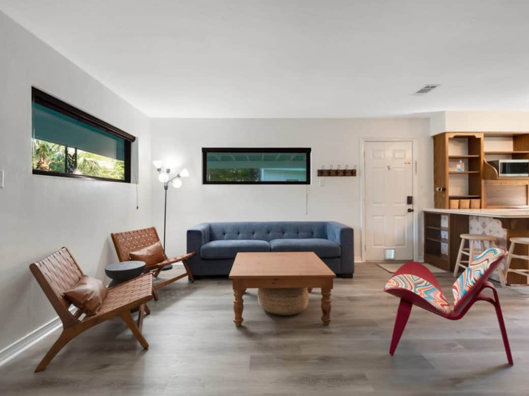 Hangout room with seating for 6 nice lighting and wall mount HDTV.