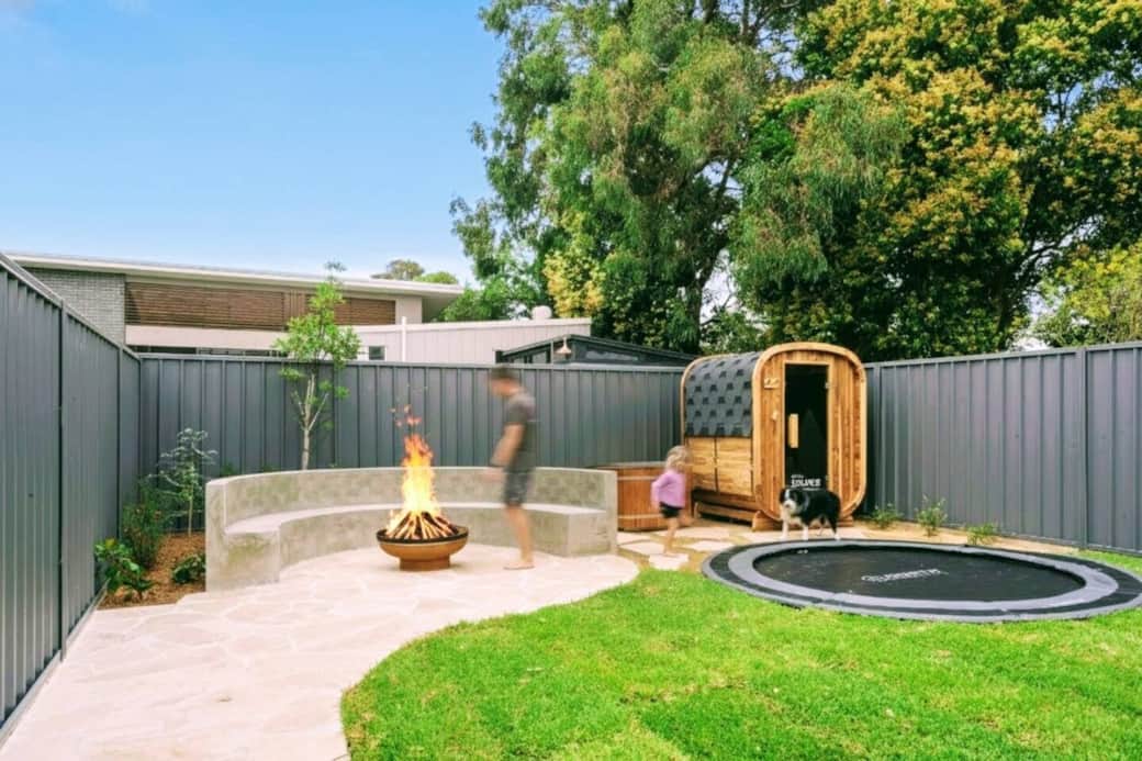 A backyard of fun, wellness and connection awaits. Cedar steam sauna, ice bath/hot tub, in-ground trampoline and fire pit await. A backyard of fun, wellness and connection awaits. Cedar steam sauna, ice bath/hot tub, in-ground trampoline and fire pit await.