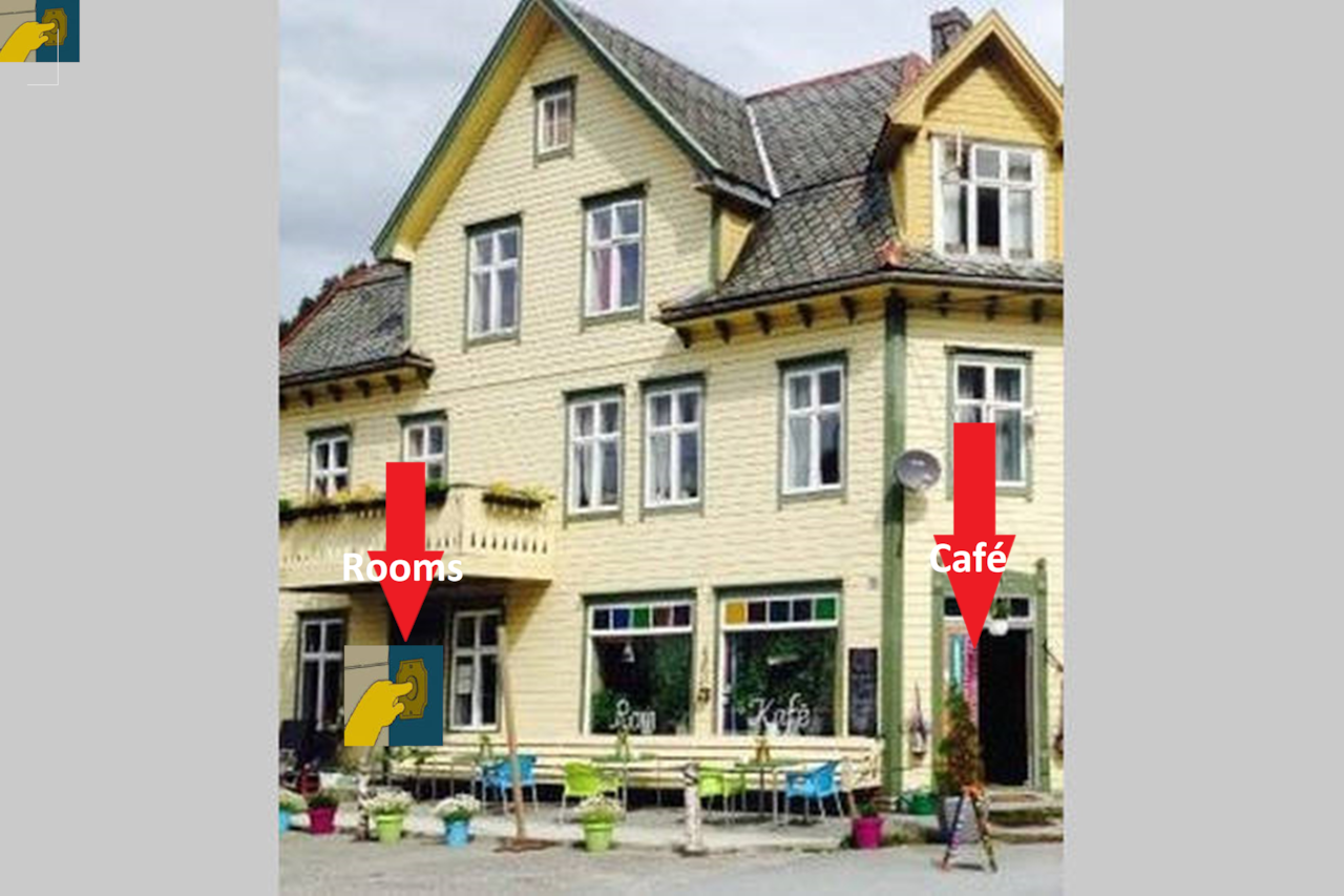 The green door is for the roms. Please ring the doorbell to check in!