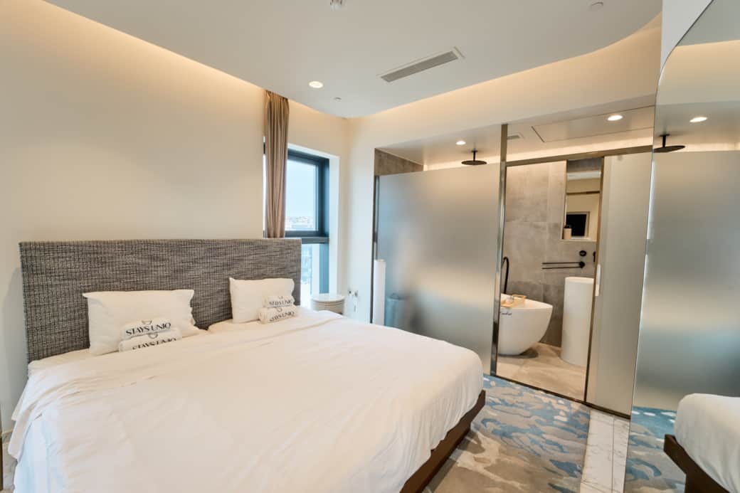 Elegant Bedroom with City Views and Ensuite Bathroom Elegant Bedroom with City Views and Ensuite Bathroom