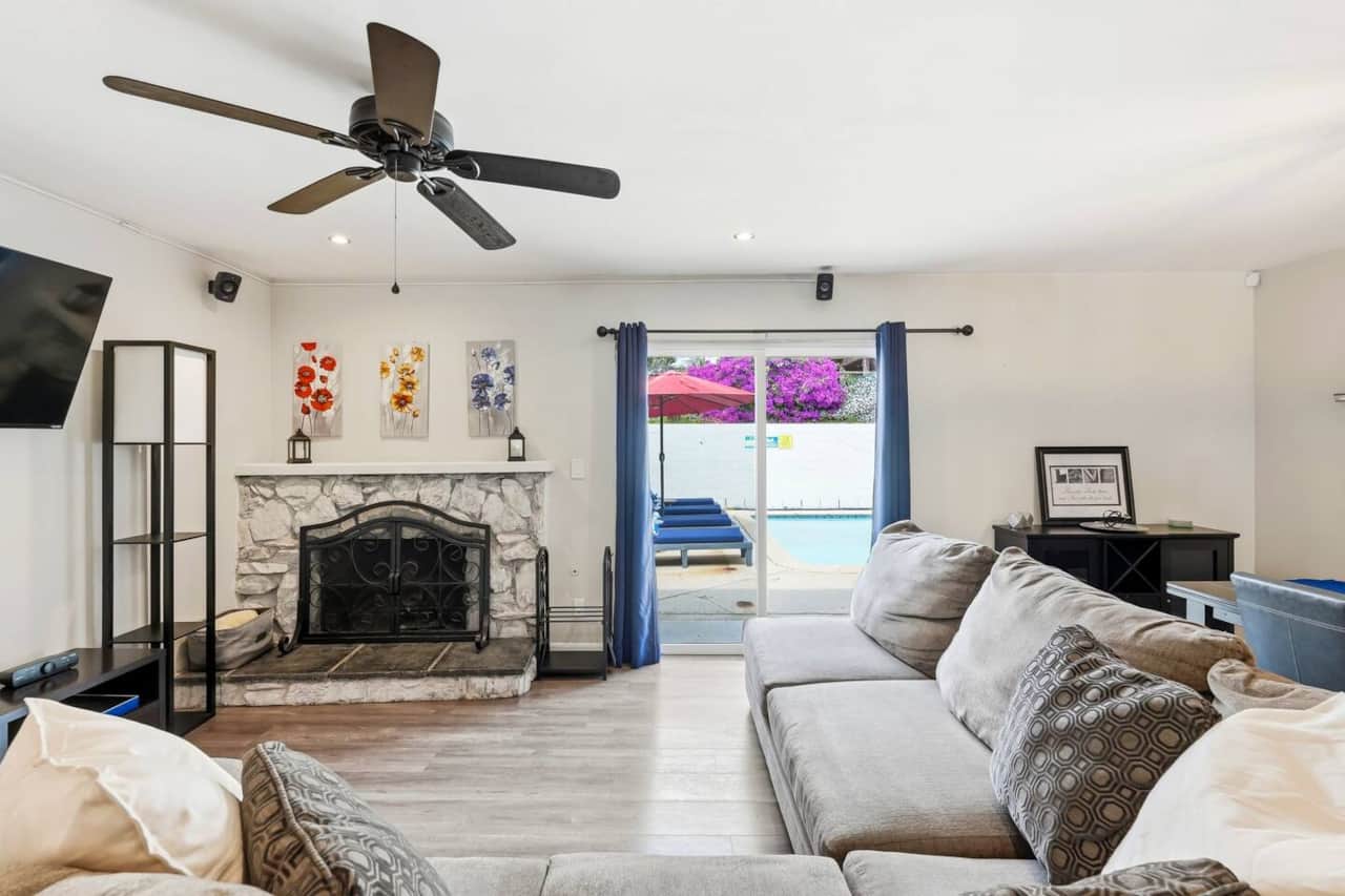Entertainment setup with wall speakers, perfect for immersive movie nights and access to the pato.