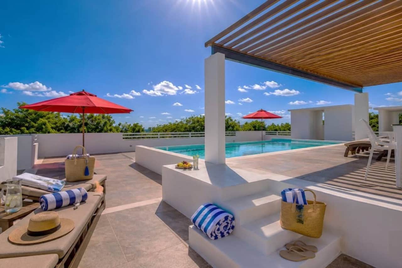 Soak up Caribbean Sea and jungle views from the shared rooftop! Take a refreshing dip in the pool, unwind on sun loungers beneath umbrellas, or enjoy a relaxed cookout with the BBQ grill.