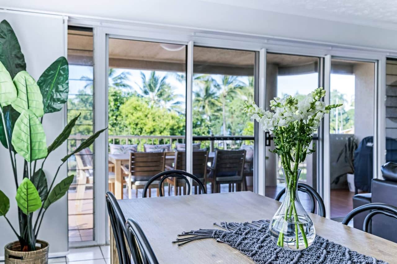 Large windows open up the living area to a light space with views of The Strand. 