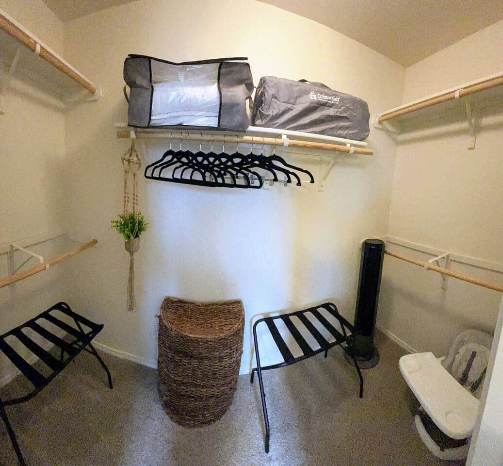 Primary bedroom closet has 2 luggage racks, clothes hangers, large clothes hamper, extra linens, oscillating fan, baby feeding chair with straps, and a travel crib. 1 sheet is provided.
Primary bedroom closet has 2 luggage racks, clothes hangers, large clothes hamper, extra linens, oscillating fan, baby feeding chair with straps, and a travel crib. 1 sheet is provided.