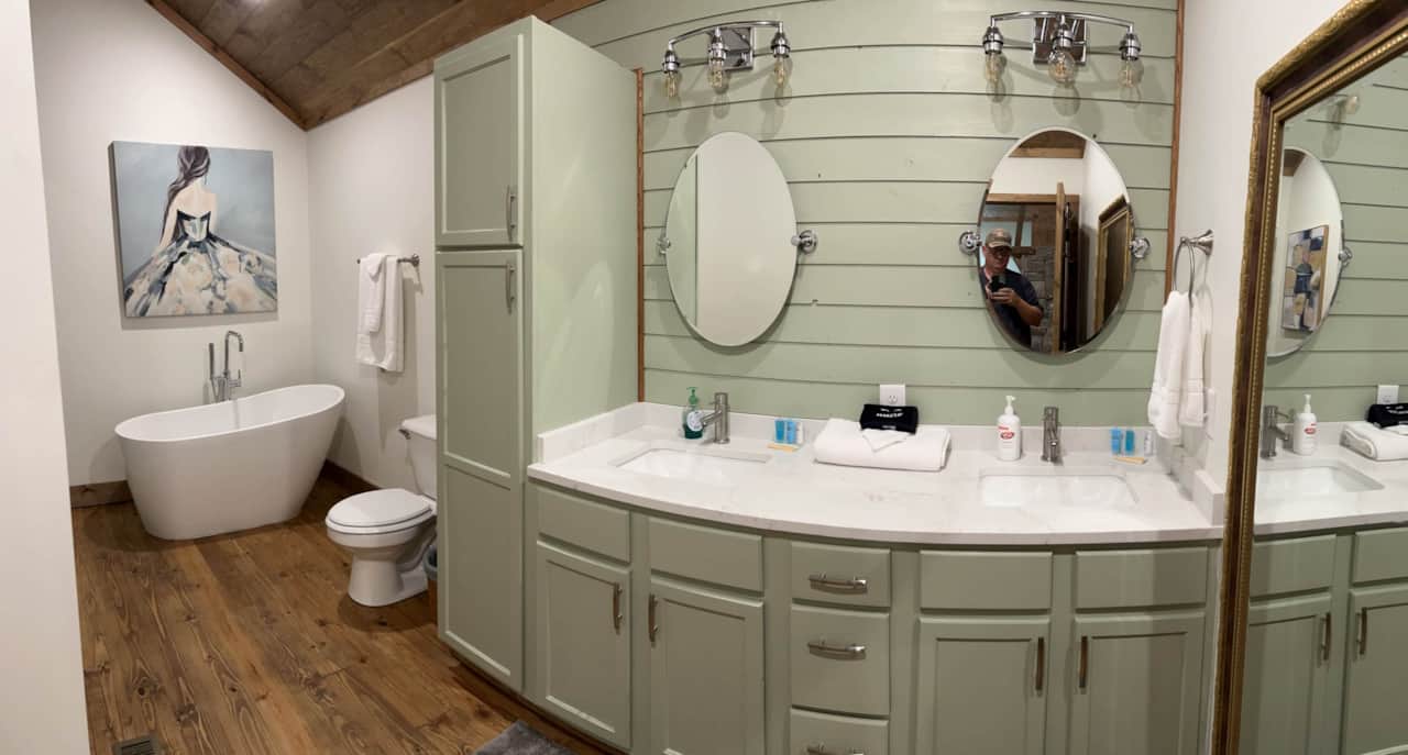 Dual Vanity with quartz countertops and your accent wall has been ship-lapped. 