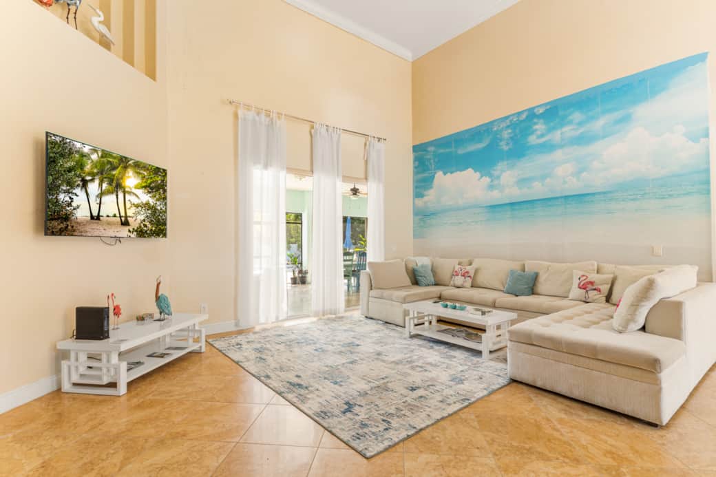 Large spacious living room, with 20 ft ceilings, joining the dinning, kitchen, breakfast areas.