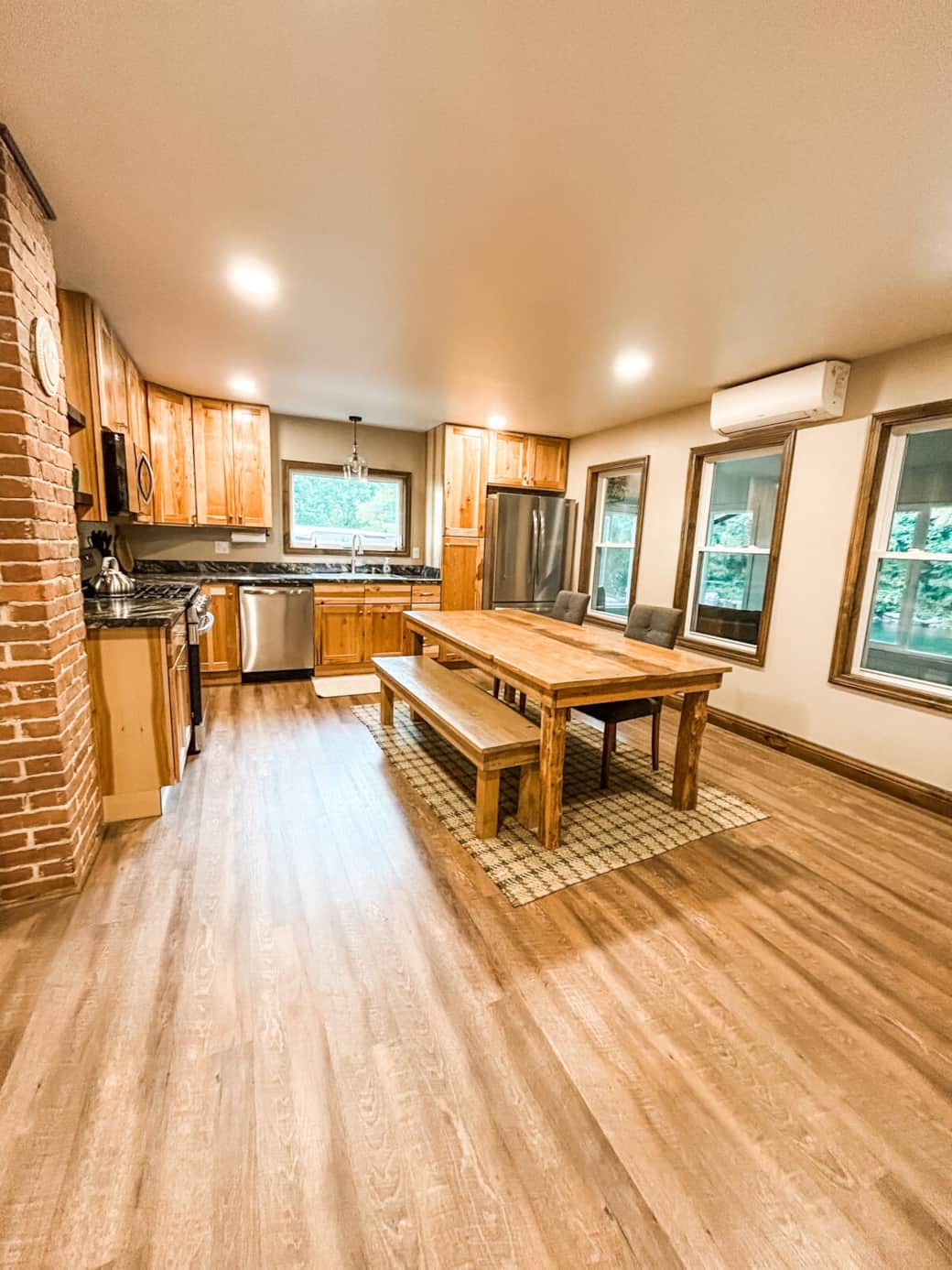 Gather ‘round the rustic dining table for home-cooked meals, game nights, or morning coffee in this warm and welcoming kitchen.