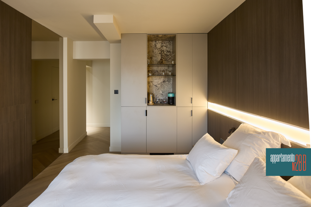 Spacious designer apartment bedroom with wood panelling and herringbone parquet, Appartamento N28b Spacious designer apartment bedroom with wood panelling and herringbone parquet, Appartamento N28b