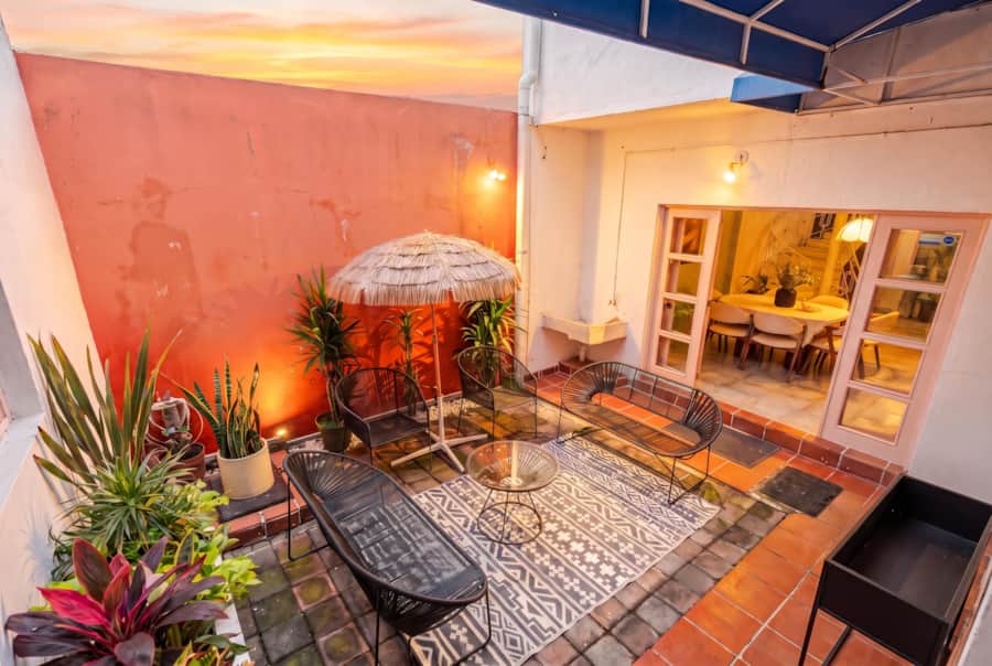 Courtyard at sunset with french doors open to the dining room at Casa Atlixco