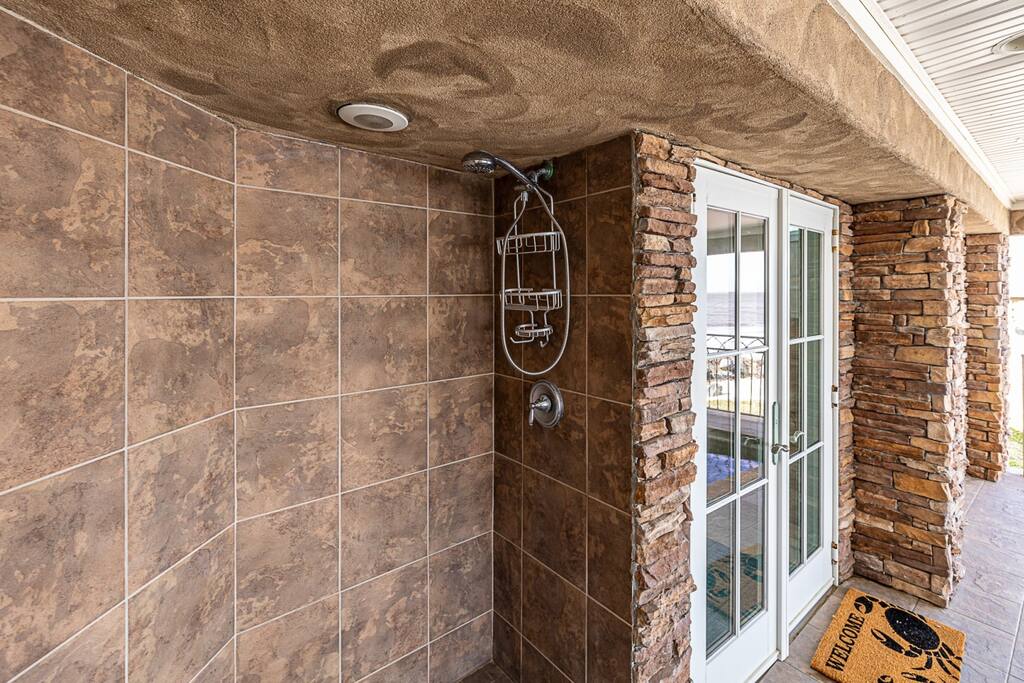 Outdoor shower in pool area.
