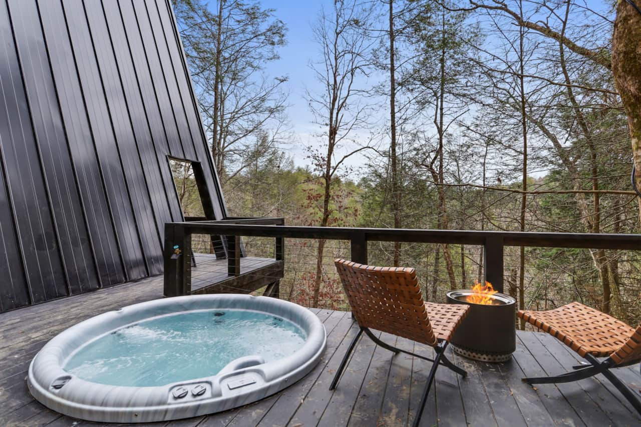 Unwind with forest views from the sunken hot tub.