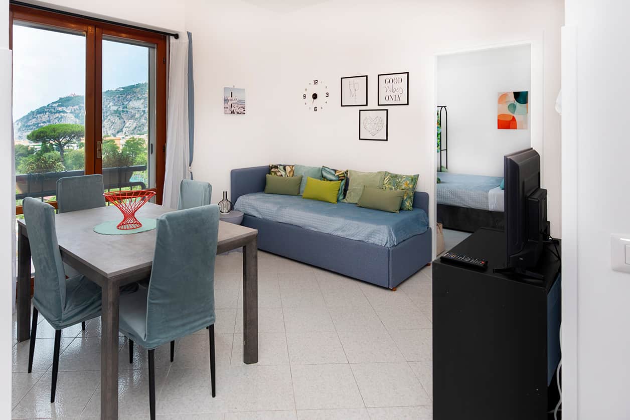 Bright Living Room with Single Sofa Bed, Smart TV and Air Conditioning