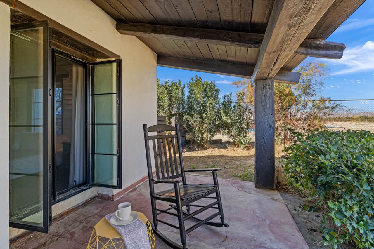Soak in warm breezes under this 1930's farmhouse porch