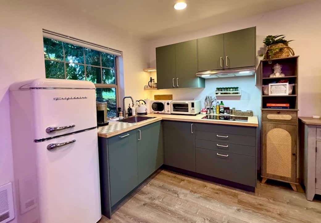 The fully stocked kitchen comes with all essentials, a dishwasher, coffee and tea, and spices.