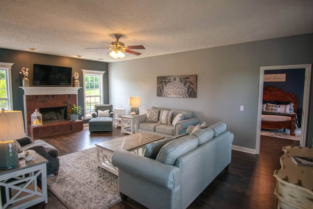 Living area on the downstairs floor includes a real wood burning fireplace for the colder seasons. 