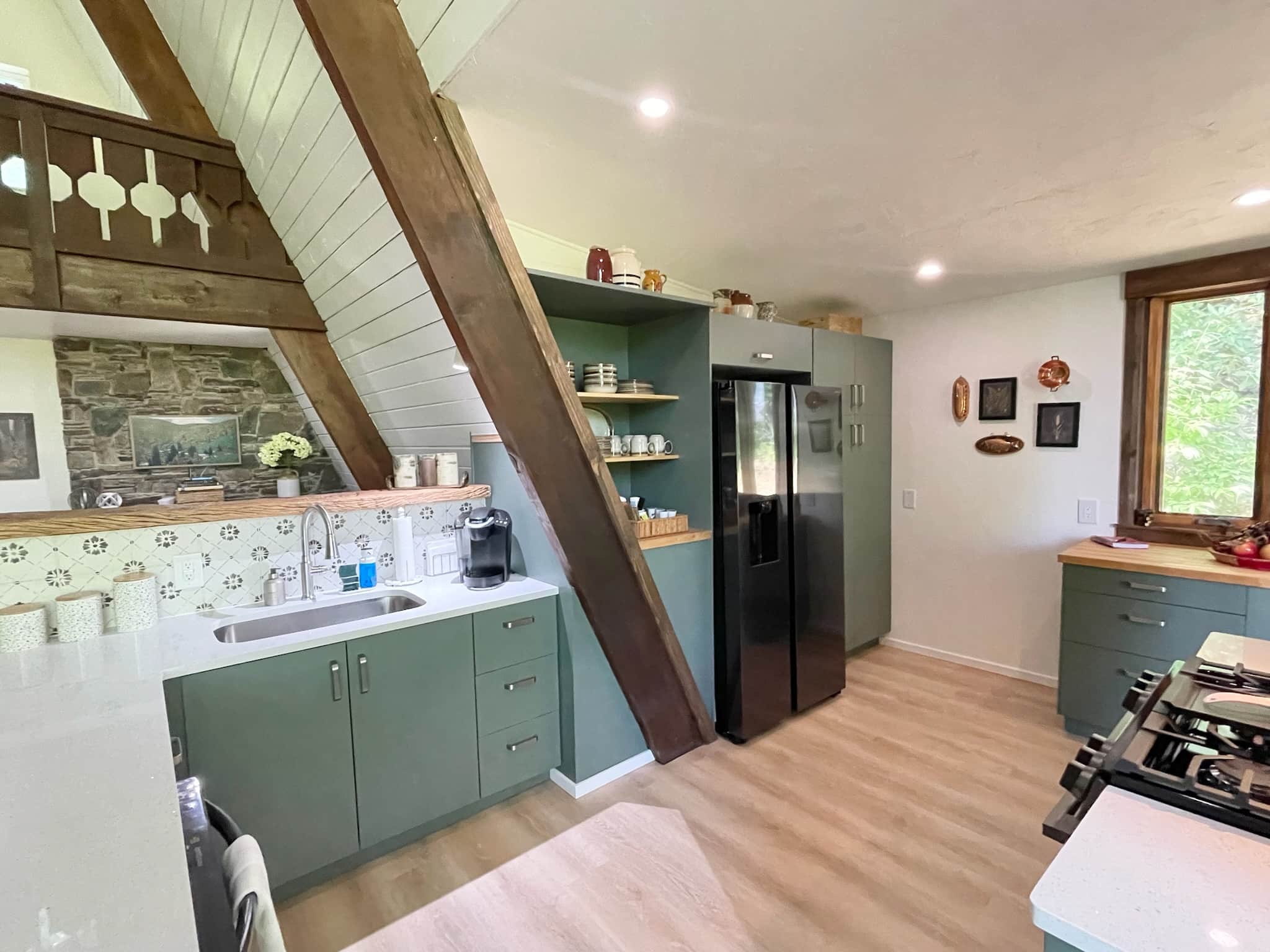 kitchen sink with fire place in the background.jpeg