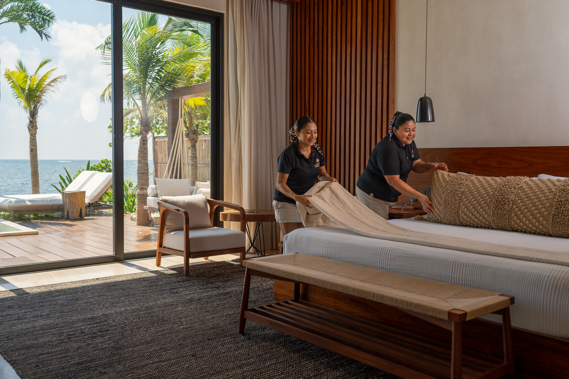 Villa TuluMar maid providing daily service in oceanfront suite