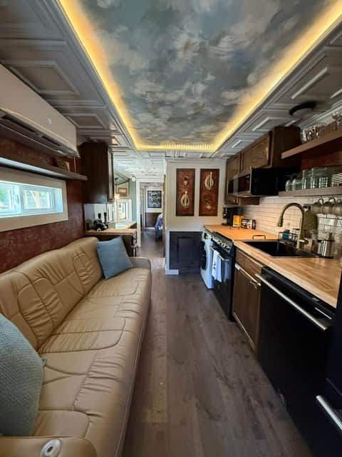 Sofa that converts to full size RV bed, full size appliances and washer/dryer.