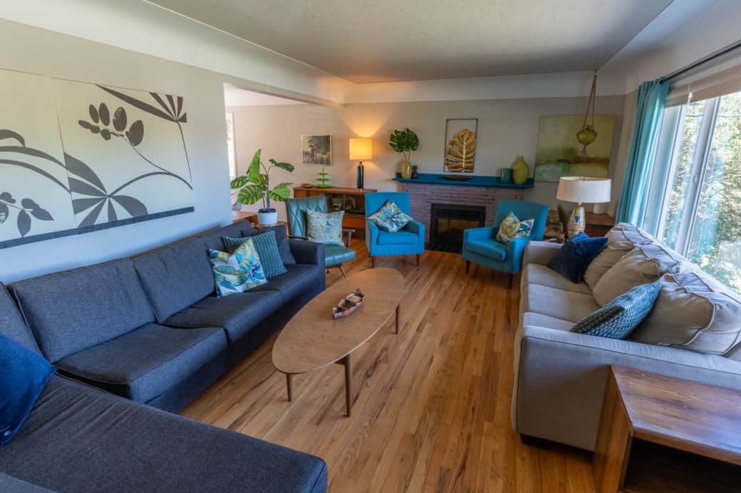 Step into a spacious, sun-drenched living room offering sweeping views of Horner Park. 