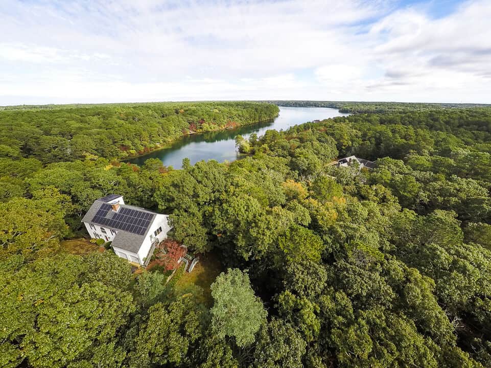 The property includes private sandy beach access to Sheep Pond