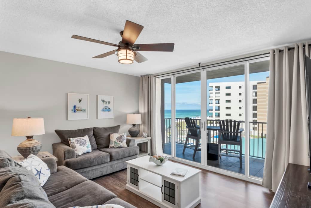 The family room has plenty of seating with a view of the beach The family room has plenty of seating with a view of the beach