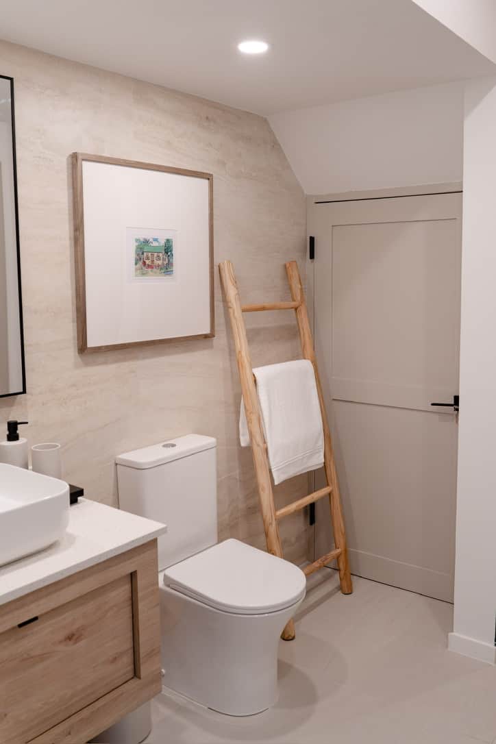 Spa-inspired bathroom with sleek finishes and rainfall shower.