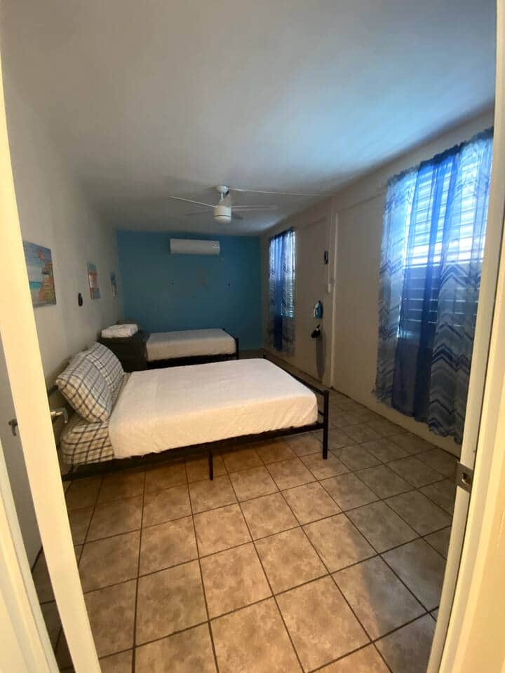 1 bedroom with two full beds for up to 4 people. Bedroom is equipped with an 18,000 Inverter Air Conditioned.