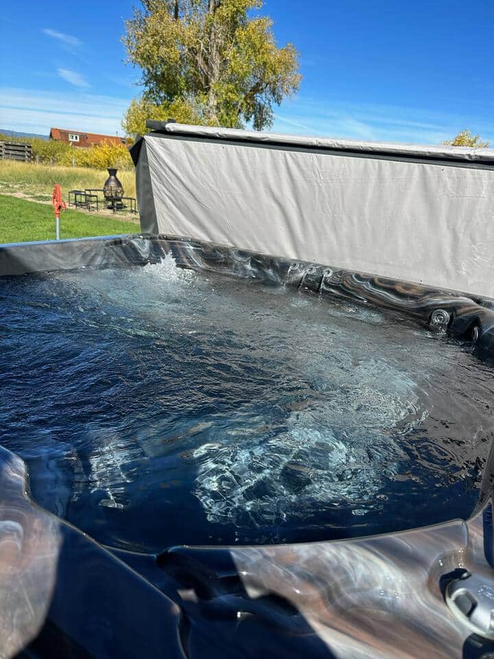 Hot tub is right outside the back door, where stargazing  and sunset views are amazing