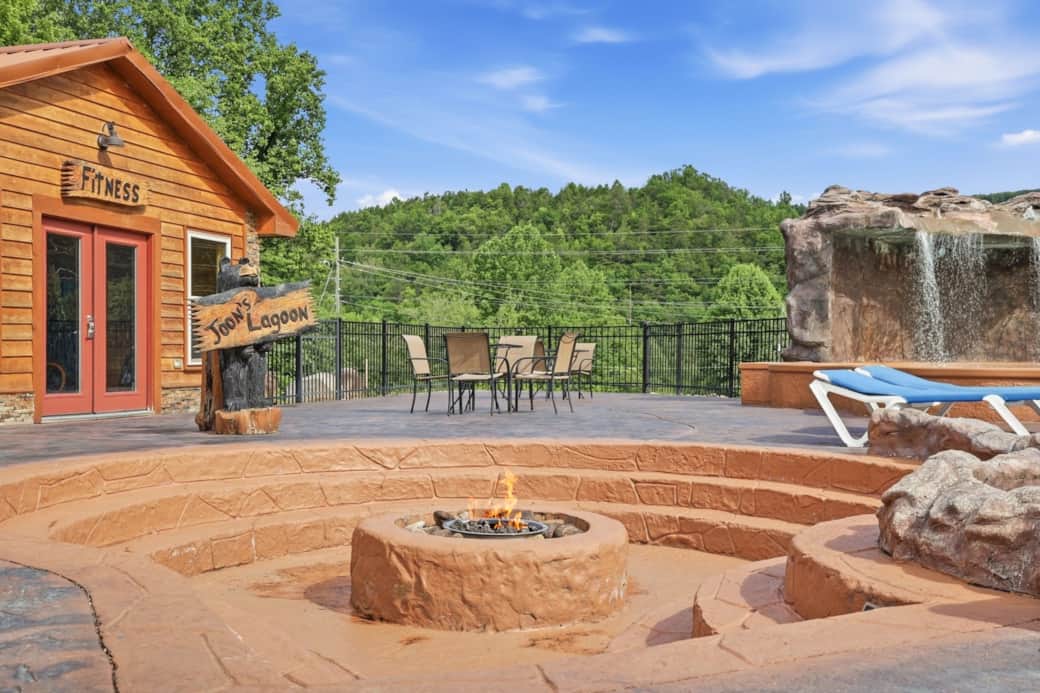 Enjoy evenings by the fire at this inviting poolside fire pit, a favorite gathering spot for guests Enjoy evenings by the fire at this inviting poolside fire pit, a favorite gathering spot for guests
