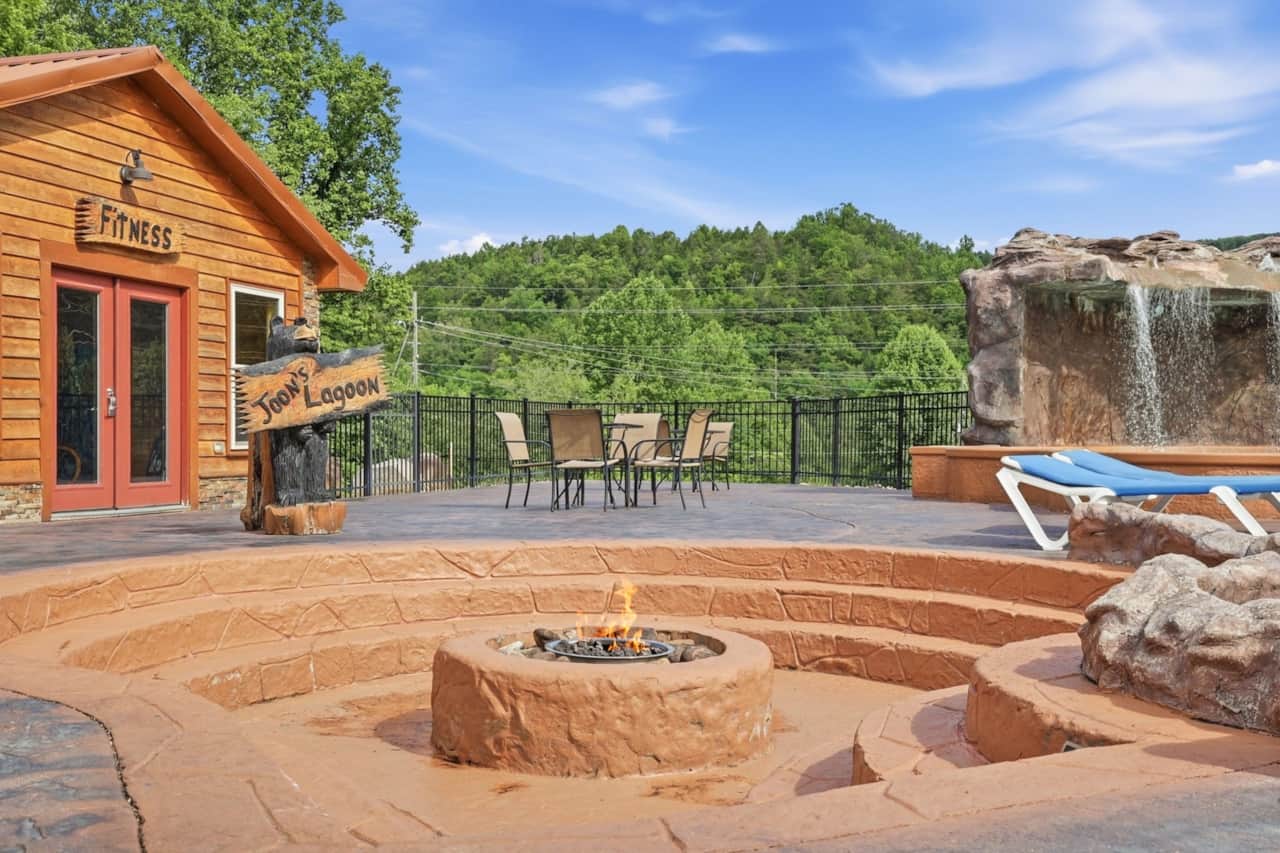 Enjoy evenings by the fire at this inviting poolside fire pit, a favorite gathering spot for guests 