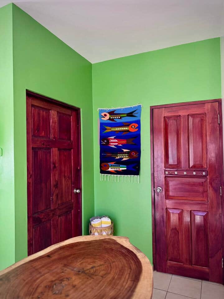 Door to bedroom on left, bathroom on right Door to bedroom on left, bathroom on right