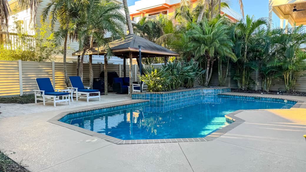 Private tropical pool and covered tiki bar