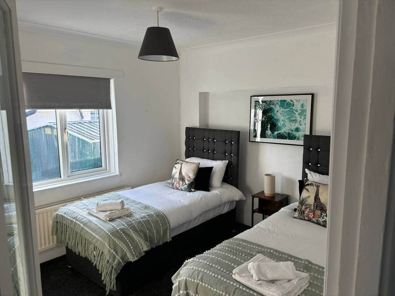 Unwind in our cozy and comfortable bedroom, perfect for a restful night's sleep. Book your stay now!