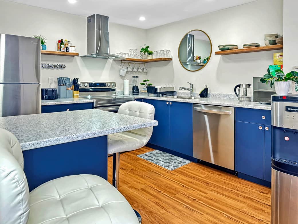 Stylish Full Kitchen with Blue Cabinets and Modern Appliances
