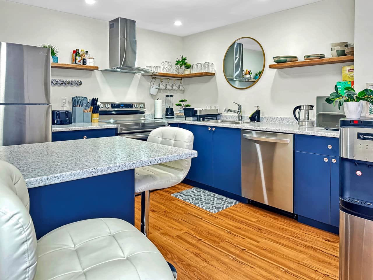 Stylish Full Kitchen with Blue Cabinets and Modern Appliances