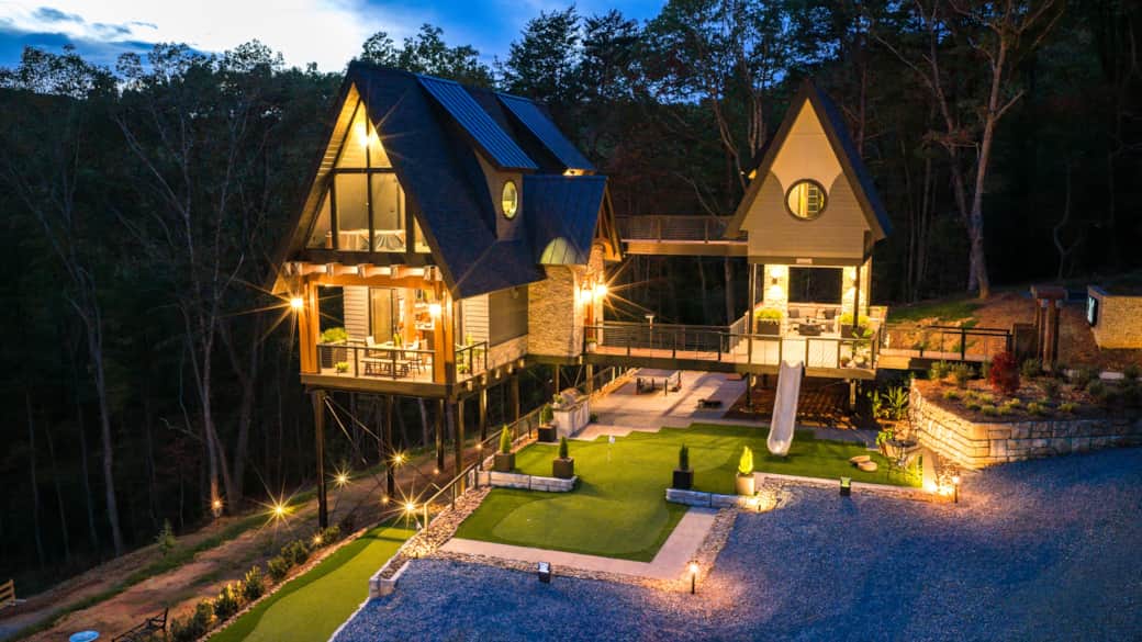 The Tom at night is just magical with illuminated outdoor living areas, firepit, and outdoor kitchen